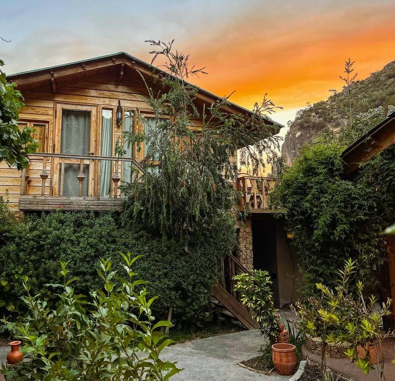 Mountain lodge at sunset